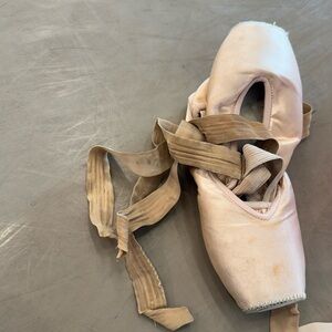 Bundle of used skin toned pointe shoes (1), tights, and flat shoes